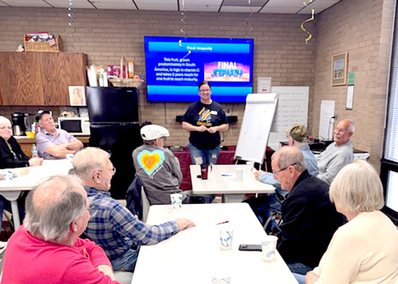 Jess Bessley at the Adult Social/Coffee Hour hosting AG Jeopardy