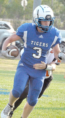 ISAAC THAYER broke a lot of tackles while fighting his way to the end zone during the junior high football game against the Ellis Railroaders last Thursday evening at Tiger Stadium.