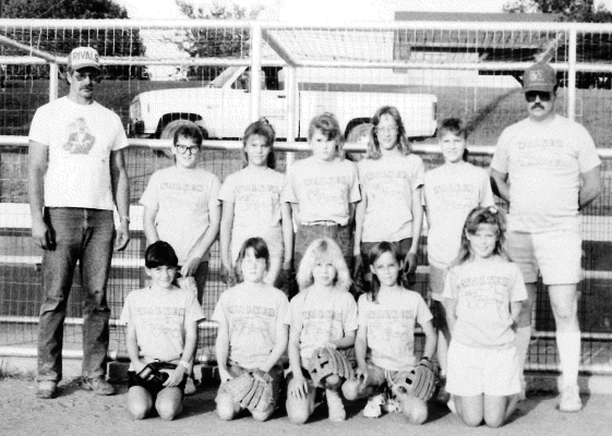 WALKER CONSTRUCTION sponsored the 1989 Girl Softball No. 4 Team for the Stockton Summer Recreation ball games. Pictured are (front row, from left) Stacey Steeples, Monica Lowry, Nichole Thayer, Amy Lowry, Mindy Hollern; (back row) Coach Mike Hollern, Erin Schmitz, Dawnite Walker, Megan Schmitz, Melilssa Hollern, Stephanie Lowry, and Coach John Walker.
