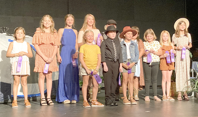 THE 4-H MEMBERS who received ribbons at the annual 4-H Style Show held on Thursday, July 21st were (front row, from left): Emery Peterson, Maverick Post, Kaylyn Becker; (back row, from left) Serenity Carpenter, Mia Odle, Trinity Couse, Emily Stamper, Tanner Post, Emilee Brown, Shoni Jones, Daylen Beesley and Hope Couse.
