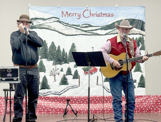 Barry Ward (right) of Winfield performed at the City Hall during Olde Tyme Christmas