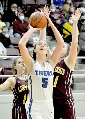 OLIVIA DIX scores two more points during the Lady Tigers’ sub-state semifinal game against Osborne last Thursday.