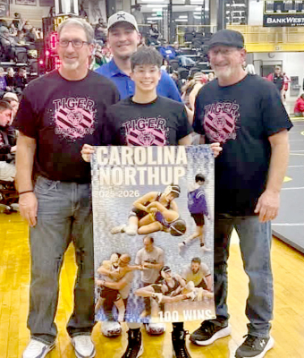 STOCKTON SENIOR CAROLINA NORTHUP celebrated her 100th career wrestling win last Friday by capturing first place in the 100-lb. division at the Goodland Holiday Classic. Northup is pictured with coaches Clint Bedore, Deyton Bedore and Justin Basart. Photo courtesy of Tabor Northup