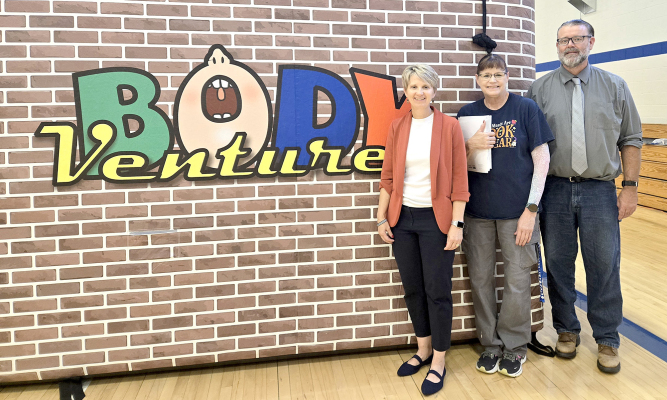 THE BODYVENTURE interactive presentation was held at Stockton Grade School on Tuesday, October 14th, for the kindergarten through fifth-grade students. Posing by the inflatable display were grade school principal Stacey Green, Stuco sponsor Diana Strutt (who wrote the grant to bring the program to Stockton), and Jonathan Miller with the Kansas Department of Education.