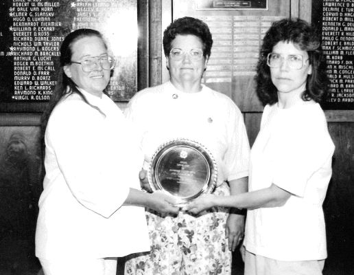 THE STOCKTON VFW AUXILIARY TO POST 8873 received the 1991 National Silver Plate Award for Community Service for the Americanism Fair. The National Representative Glenetta Volegsang of the VFW Auxiliary presented it at the Department Convention at Dodge City. Holding the award are (from left) Nina DeSair, President of the Auxiliary, Virginia Doughty 9th District President, and Becky Lowry, Americanism Chairman.