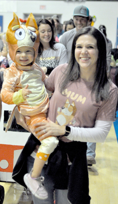 AMELIA HANSON, and her mom, Taylor, were all smiles as they took a couple laps around the gym during the Halloween Costume Parade held at the annual Goblin’s Glory. They were among the many participants parading their costumes.