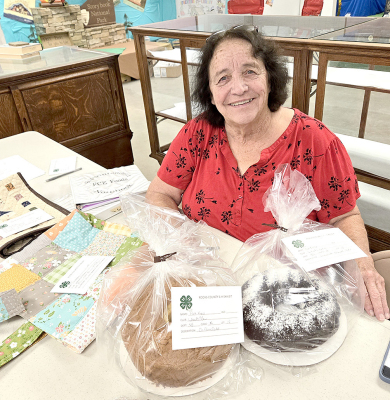 RUTH ANN BIGGE helped with the FCE entries at the Rooks County Free Fair. The two categories members can enter items in are for cooking and domestic arts.