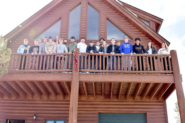 TAKING A PICTURE ON THE BALCONY OF RYAN’S RETREAT were the SHS Seniors during their class trip they took in March. The cabin was built in memory of John and Bobbi’s son.