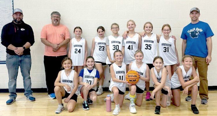 MEMBERS OF THE SRC GIRLS BASKETBALL TEAM, who competed the first four weekends of November, are front row, from left: Bryah Stithem, Madelyn Swaney, Norah Muir, Emery Peterson, Ayla Terry, and Kaylee Clayton; back row, from left: Coach Bryant Muir, Coach Jack Kuhlmann, Cambry Glendening, Zoey Toll, Adalyn McNulty, Raya Kuhlmann, Makinley Riener, Evelynn Hilbrink, and Coach Jeff Riener. Not pictured is Joree Dibble.