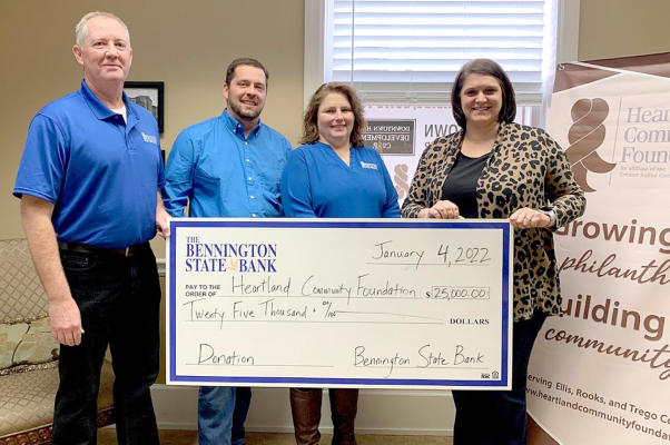 BENNINGTON STATE BANK made a significant donation of $25,000 to the Heartland Disaster Relief Fund, of which $10,000 apiece will go to Rooks and Ellis Counties, and $5,000 to Trego County. From left, Jolan Ward, Bennington State Bank Loan Officer, Ryan McMillan, Bennington State Bank Vice President Loan Officer, and Amy Hitter, Bennington State Bank Lending Operations Officer present a check to Sarah Meitner, Executive Director of Heartland Community Foundation.