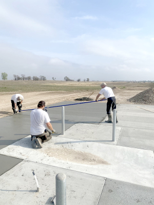 WORKING on the new dump station north of Lakeview Campground at Webster State Park were Ethan Kriley, Adam Bryant, and High Plains Regional Supervisor Steve Siebel.