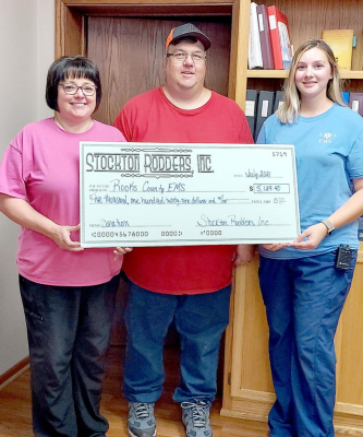 THE STOCKTON RODDERS presented the Rooks County EMS with a donation check in the amount of $5,129.40 at the Stockton City Commission meeting on Tuesday, July 20th. Pictured accepting the donation from Stockton Rodder Dean Kester (middle) were Rooks County EMS Director Julie Cole (left) and AEMT Megan Niblock (right).