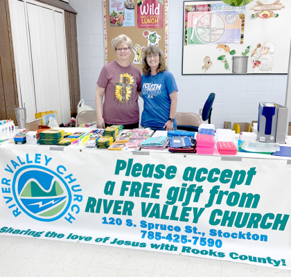 RIVER VALLEY CHURCH MEMBERS Deb Carsten and Chelsey Foerster were on hand at the USD 271 enrollment, handing out school supplies and backpacks to the students as they get ready to embark on their new school year.