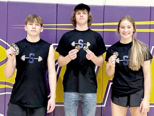POWERLIFTING MEDALISTS! Tigers medaling at the powerlifting meet in WaKeeney last Saturday were from left: Cason Iwanski, Trent Becker, and Ava Dix. (Courtesy Photo)