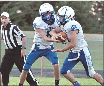 Max Moffet handing off to Emerson Lowry vs. Logan/Palco