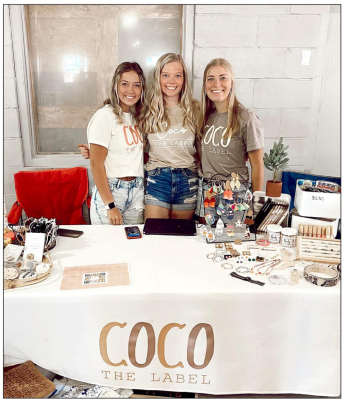 PAYTON KELLER, co-owner of COCO The Label, is pictured with her two employees Claire Plumer (left) and Blair Walters (right). Not only do Payton and her mother, Daneen, have a storefront in Stockton and a busy online business, they also travel to area towns to sell their merchandise at local vendor fairs.