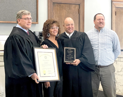 ROOKS COUNTY CLERK OF THE DISTRICT COURT CONNIE STITHEM was honored for her 29 years of service on Wednesday, November 2nd. Pictured are (from left): District Judge Tom Dreese, Connie Stithem, Magistrate Judge Doug Bigge and Court Administrator Mike Smith. (Courtesy Photo)