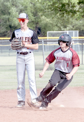PLAINVILLE’S TRAXTON SMYTH looks to advance to third against Ellis.