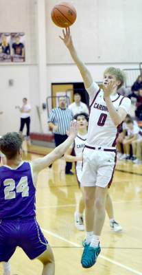 Plainville’s Erik Mackey (#0), vs. Oakley