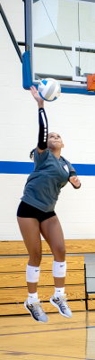 LADY TIGER FRESHMAN Adrienne McCoy jump serves during the scrimmage held prior to the Tiger Bash on Friday, August 22nd, at the Stockton Junior High Gymnasium.