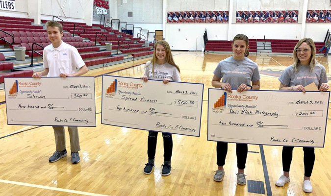 THREE TEAMS competed in this year’s Youth Entrepreneurship Challenge hosted by the Rooks County E-Community and Economic Development. Pictured are (from left): Bryan Garvert , winner Kate Hansen, and the team of Ashlynn Stamper and Brooke Nuss. (Photo Courtesy of Roger Hrabe)
