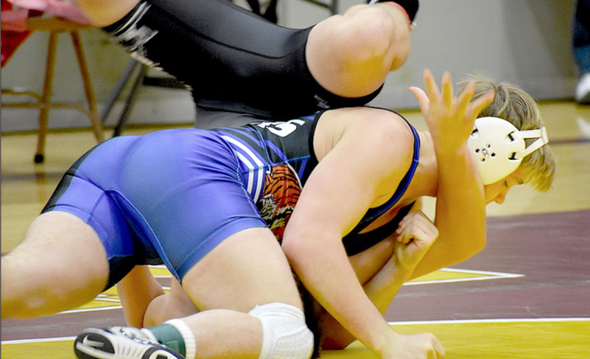 JUSTUS HULSE, a Tiger senior, wrestled his way to a first-place finish in the Ellis Round Robin last Friday, earning a fall in each of his matches. (Photo courtesy of Bobbi Basart)