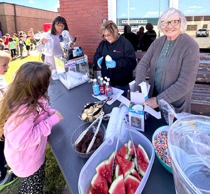 KATHY RAMSAY, DEANN RAAB, AND TONI ANDERSON serving snow cones and running the free concession stand during the 'I MATTER' Monday party.