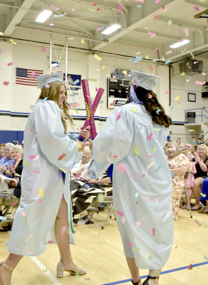 SENIORS BRIN MUIRAND BODYE STITHEM chose to walk out of Tiger Gymnasium through falling confetti as Commencement came to a close last Saturday afternoon.