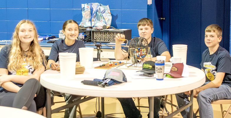Hadlee Sterling, Corbyn Glendening, Garrison Mongeau and Hudson Kriley taking care of BINGO at the Stockton FFA Goblin’s Glory