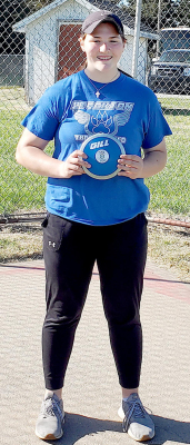 KAELYN MEANS set a new school record in the Discus last Friday at Quinter with a toss of 120’3”. Marissa Haines’ old record of 113’3” had stood since 1995. (Photo courtesy of Clint Bedore)