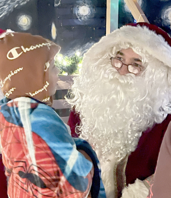 Cayson Earl having a conversation with Santa