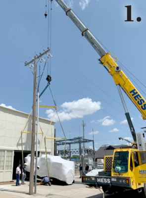 1. HESS CRANE had the monumental task of moving the City’s new generator as close to the building opening as it could get. Since the ten thousand pound battery was not installed at the time the generator was being moved, the weight of the unit was off center making the crane operator slowly move the generator a little at a time before adjusting the chains until it was successfully set down on rollers for the next phase of the installment process.
