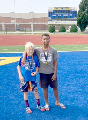 JEVIN RUSH, left, and Treyvonn Clark, right, competed August 2 at the Smoky Summer Smash in Lindsborg, with both bringing home first-place medals. (Courtesy Photo)