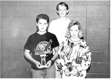 LIMERICK FIRST PLACE WINNERS who were recognized and received awards at the 1991 annual Rooks County Soil Conservation meeting were (from left) Bobby Berland, Aron McReynolds, and Dana Balthazor.