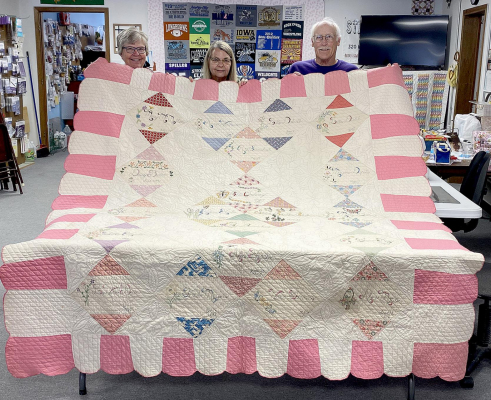 MEMBERS OF THE STITCH & CHATTER CLUB, that had been organized over 60 years ago in Rooks County, sewed the friendship quilt that is pictured. John and Deborah Sidewell presented the quilt to Idona Duncan, whose sewing business is also called “Stitch &amp; Chatter.” Pictured are Idona Duncan, Deborah and John Sidewell.
