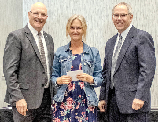 ATTHE AWARDS LUNCHEON held on October 22nd, Mary Workman of Stockton was recognized with an award for her years of service to the Kid-Link program in Stockton. Mary retired this year after her dedicated service to the program. Pictured from left to right are Jerry Michaud, DSNWK President, Mary, and Andy Beck, Chairman of the Board.
