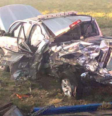 THIS IS WHAT IS LEFT of Phillips County Deputy John Miner’s patrol truck, after it was hit by a semi and burned due to diesel fuel that sprayed over the crash site when the fuel tank of the semi ruptured upon impact with the other three vehicles.