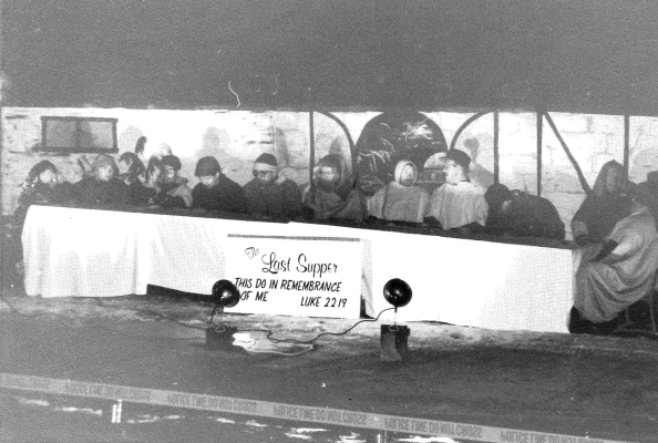THE MAIN STREET CHRISTIAN CHURCH had depicted “The Last Supper” as their Living Christmas Card during the evening hours in December of 1994 when each church made a living display on the front lawns of the schools. People lined the streets to walk by each display of this annual event.