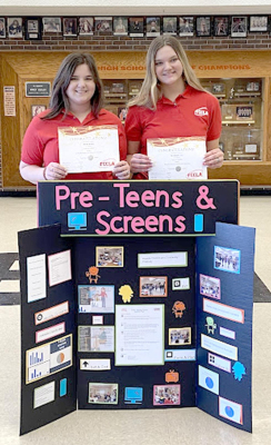 STOCKTON FCCLA MEMBERS Sierra Kester (left) and Savannah Gray (right) earned a silver award at District B STAR Events recently for their project, “Pre-Teens and Screens/”