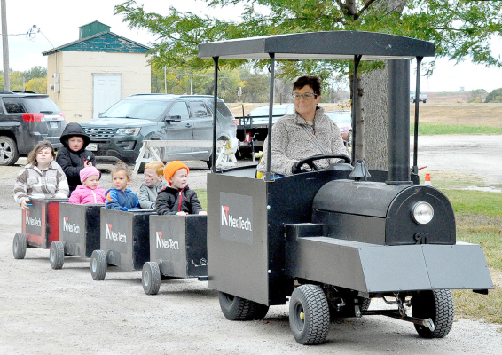 Stephanie Niblock conducts the Nex-Tech train last Saturday at the Pumpkin Patch