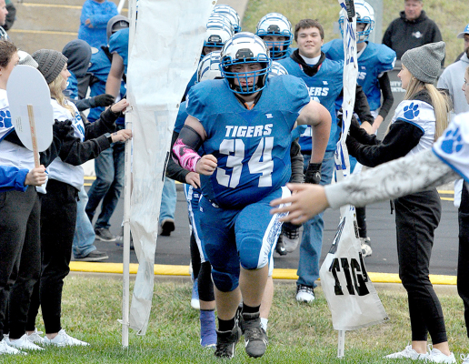 RYAN MONGEAU leads the SHS Football Team through the Tiger Tunnel, as Stockton takes the field for the Homecoming game against Decatur Community last Friday evening.
