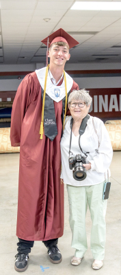 AT THE PLAINVILLE HIGH SCHOOL COMMENCEMENT on Saturday, May 16, Candace Rachel—Plainville’s pint-sized photographer—beams beside her self-proclaimed ‘Tall Boy,’ Ben Rinehart, the tallest senior in the Class of 2026. Proof that the best moments come in all sizes!