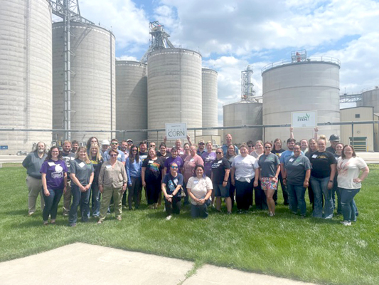 STOCKTON HIGH SCHOOL’S SCIENCE TEACHER ANTHONY COLE recently completed a two-day Seed to STEM workshop. Dr. Cole is holding the corn sign in the group picture taken at the event.