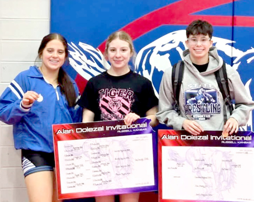 TIGER MEDALISTS at the 2025 Alan Dolezal Invitational wrestling tournament held in Russell last Saturday were Mia Odle (second), Saj Snyder (first), and Carolina Northup (first). (Courtesy Photo)