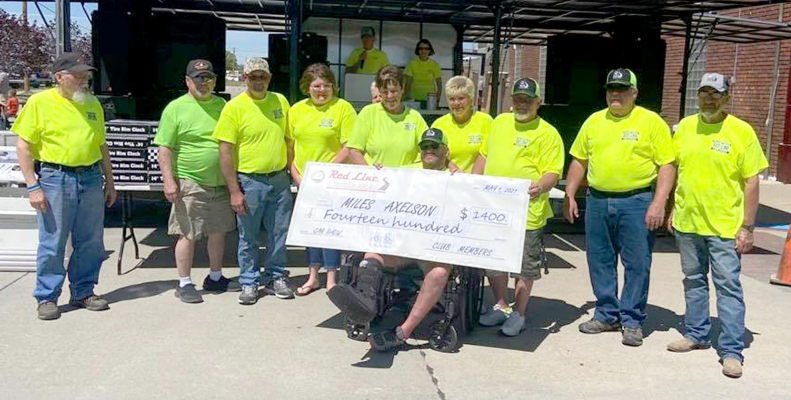 THE 5TH ANNUAL PLAINVILLE RED LINE CRUISERS CRUISE NIGHT &amp; CAR SHOW helped benefit Miles Axelson who was injured in a vehicle accident last July. The Red Line Cruisers appreciate all those who made donations and participated in the weekend fun. Special prayers for a speedy recovery to Miles, pictured, holding a check in the amount of $1,400 to help with medical expenses.