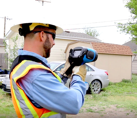A MIDWEST ENERGY GAS EMPLOYEE in Hays uses a laser gas leak detection device to identify a potential gas leak from nearly 100 feet away. Midwest recently received a $580,800 grant from the Pipeline and Hazardous Materials Safety Administration to purchase 20 of the leak detectors, which will be distributed to all Midwest Energy’s gas reporting locations.