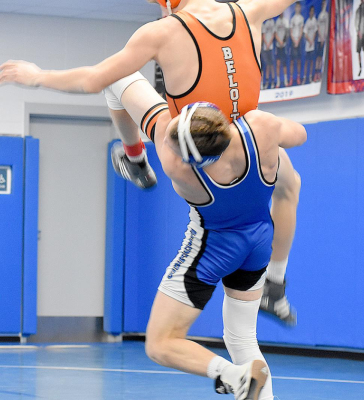 LEIGHTON COLBURN picks up Tristan Thompson of Beloit during the sub-state tournament match which Colburn won with a 14-8 decision. (Photo courtesy of Bobbi Basart)