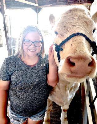 OLIVIA LUNA with Eager Beaver 4-H is getting her heifer ready for this year’s Rooks County Free Fair.