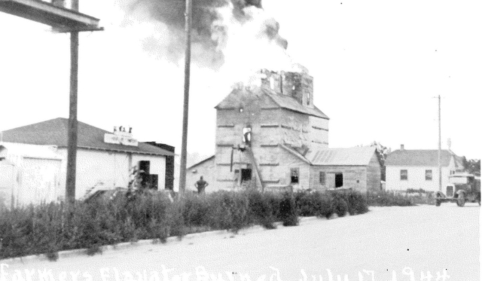 THIS PICTURE POSTCARD shows the Farmers Elevator as it was burning on July 17th, 1944. The building was located on the site of the present Farmers Union Elevator.The photo is courtesy of Earl Richardson who brought it into the Sentinel years ago.