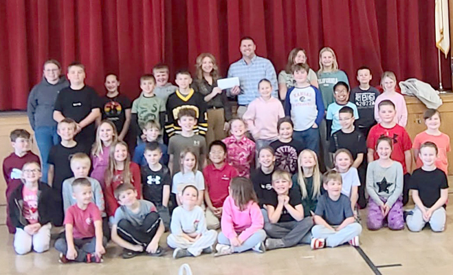SACRED HEART SCHOOL STUDENTS raised $105.00 for Plainville’s “The Yard” project during Catholic Schools Week. The boys and girls also celebrated Kansas Day by crafting decoupaged box turtles in honor of the state's designated reptile, and designed their own “Faith” t-shirts as some of the many projects they did throughout the week.
